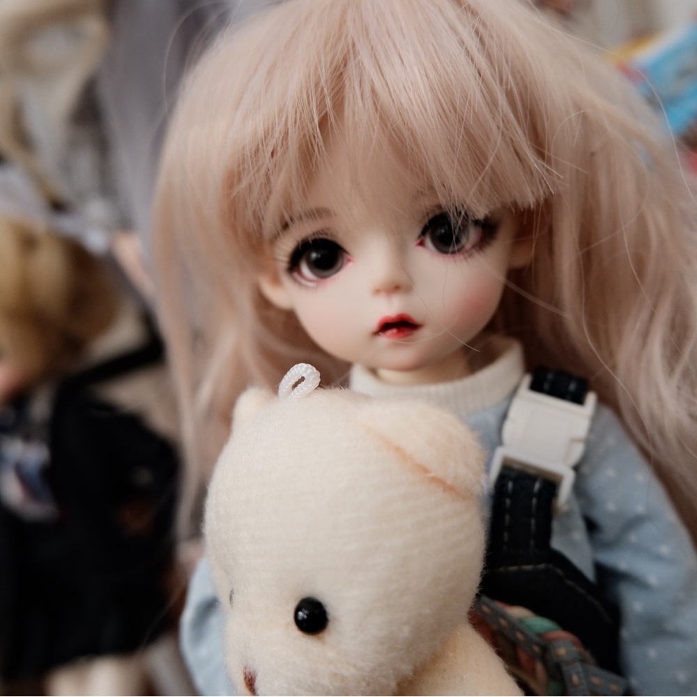 Adorable Doll with Blonde Hair and Bear